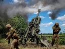 Ukrainian soldiers fire a shell from a M777 Howitzer near a frontline in the Donetsk region, June 6, 2022. It's clear that what the Ukrainians really want from the West is more big guns.