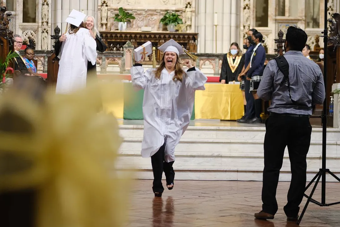 Emily Lewis celebrates after receiving a parent council award during her Grade 12 graduation ceremony on Wednesday with fellow students of St. Joseph's College School, an all-girls Catholic school in Toronto.