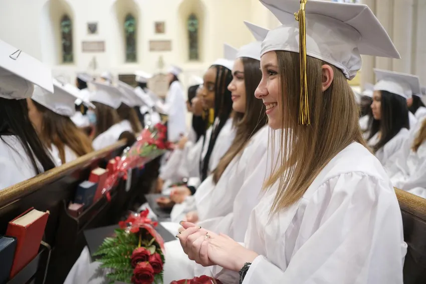 Solana Godin and fellow students at St. Joseph's College School's first in-person graduation ceremony Wednesday since the start of the pandemic.